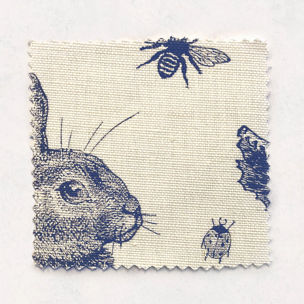 Rabbit & Cabbage Delft Fabric Sample on Oyster Linen